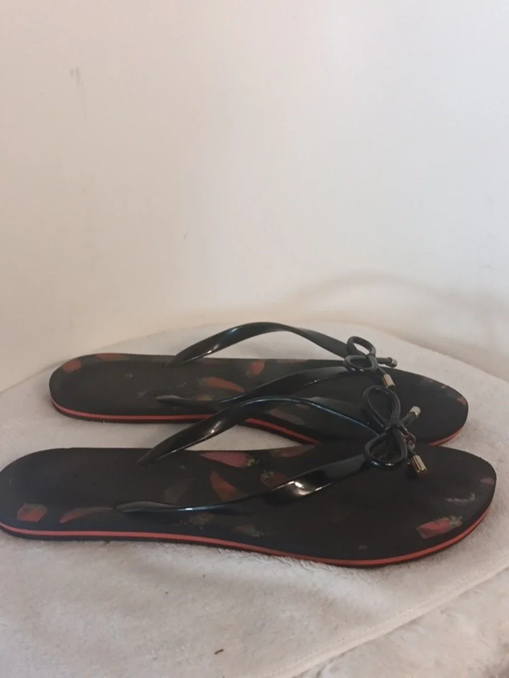 kate spade Black Flip Flop Sandals with Red Pepper Print and Bow